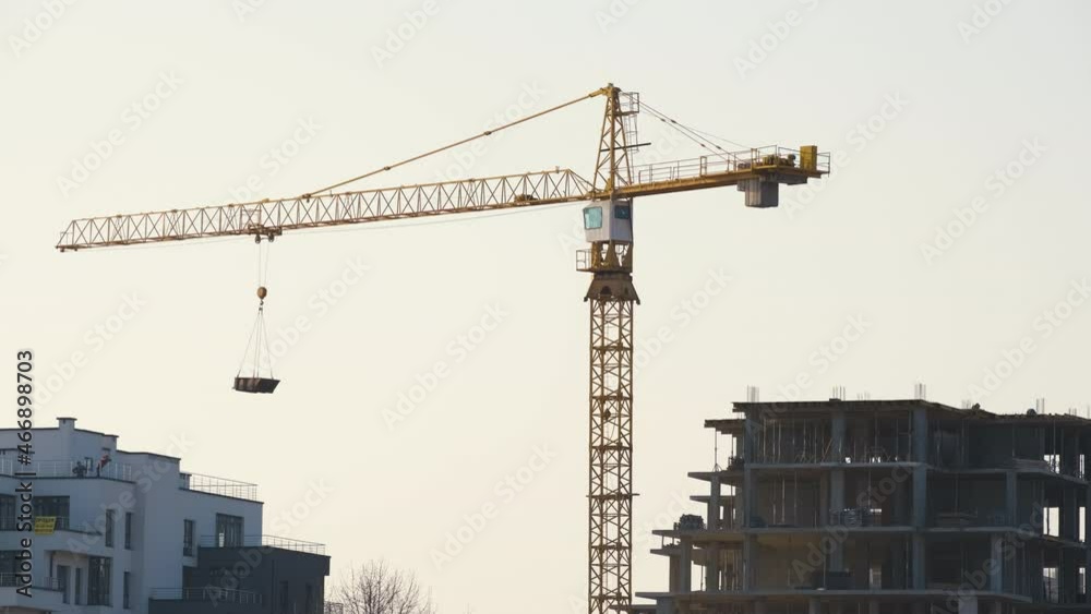 Aerial view of tower cranes and high residential apartment buildings under construction. Real estate development Aerial view of tower cranes and high residential apartment buildings under construction. Real estate development