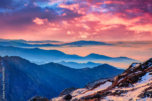 Vivid colorful Himalaya golden orange sunrise over blue mountains at Laurebina La pass, Himalayas, Langtang, Nepal.