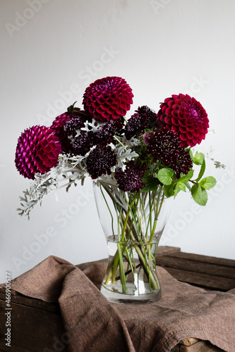 Dahlias bouquet on a wooden table