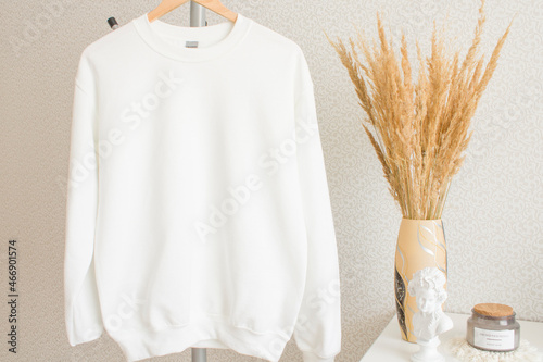 White mockup with blank sweatshirt and pampas grass on the boho background. 