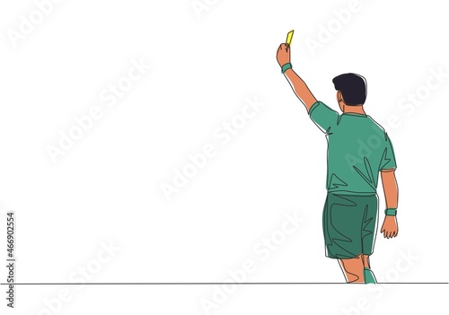 One single line drawing of young referee booked a player yellow card for the foul at the match. Soccer sports concept. Continuous line draw design vector illustration
