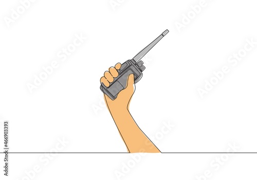 One single line drawing of man holding walkie talkie to communicate. Communication device concept. Continuous line draw vector design illustration