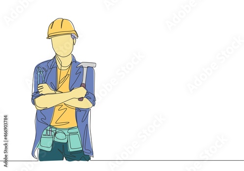 One continuous line drawing of young handsome craftsman holding hammer and pose crossing hands on chest. House maintenance service concept single line draw design illustration