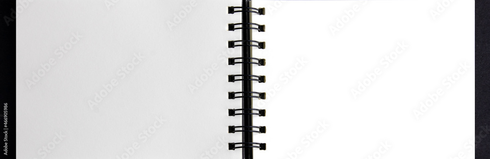 blank notebook page on black background. with copy space