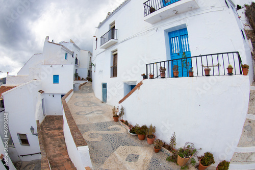 Fototapeta Naklejka Na Ścianę i Meble -  Beautiful streets in Frigiliana, Málaga, with blue doors