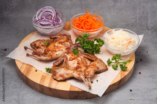grilled quail with onions, carrots and cabbage
