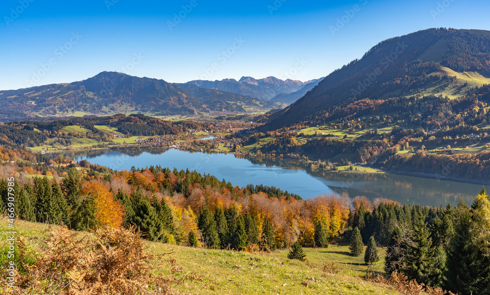 landscape in autumn mood above  lake Alpsee near Immenstadt with Gruenten summit in background, upper Allgaeu, Bavaria, Germany