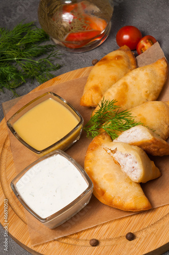 posekunchiki - small pies with meat, with mustard dressing and sour cream photo