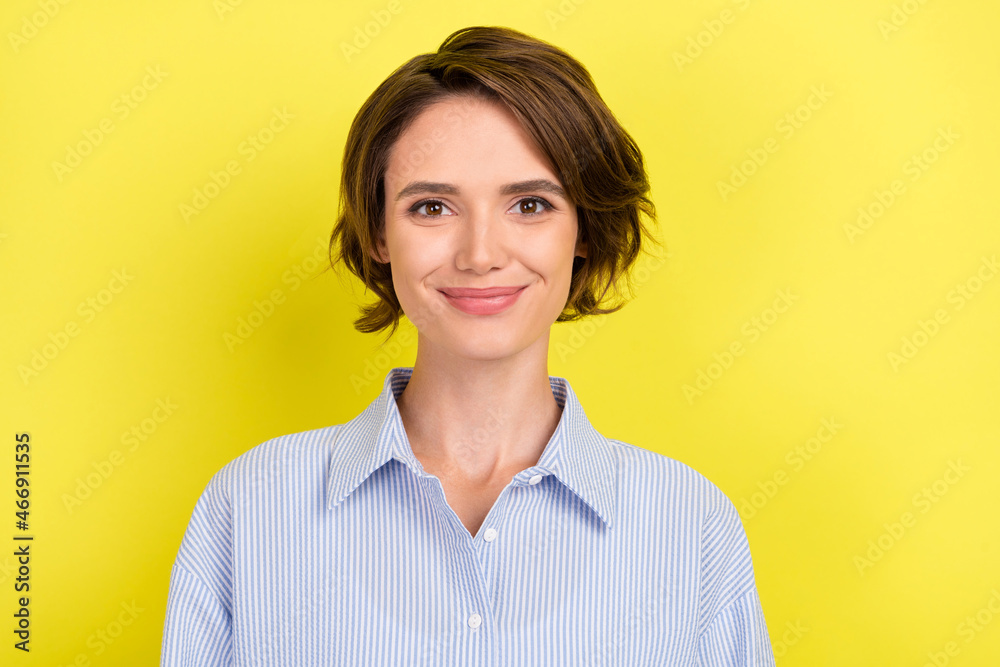 Photo of young attractive business woman happy positive smile agent isolated over yellow color background Photo of young attractive business woman happy positive smile agent isolated over yellow color background