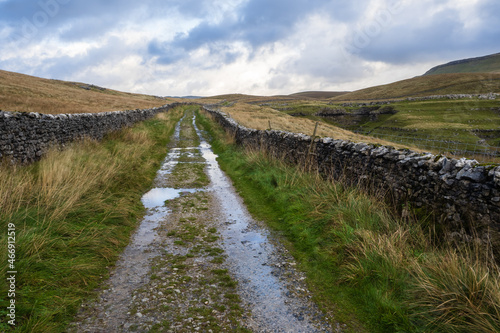 Signpost at Horton in ribblesdale showing the pen-y-ghent walk