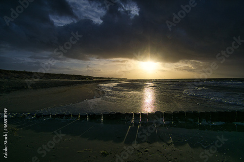view over the bunes into the baltic sea at sunset. photo