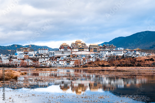 Fototapeta Reflection on the lake of Songzanlin Temple in Shangri-La, Yunnan, China