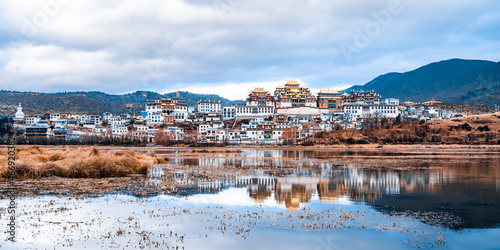 Reflection on the lake of Songzanlin Temple in Shangri-La, Yunnan, China