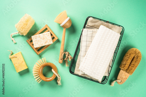 Zero waste cleaning utensils for kitchen. Natural brushes, soap and towels, plastic free. Flat lay imagewith copy space. photo