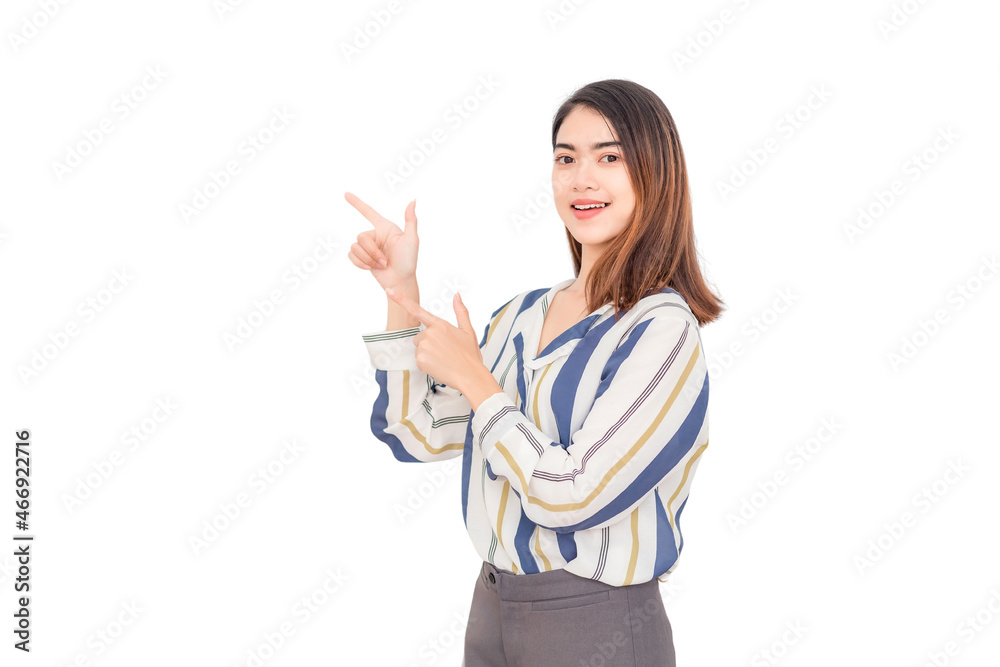 Thai long haired Asian woman wearing long sleeves, she is looking at the camera smiling and pointing to the left against a white background.