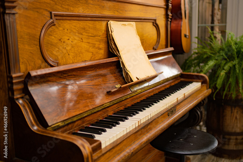 old piano in the interior of the house. collection of musical instruments.
