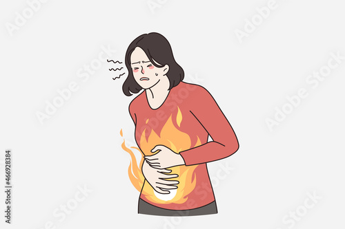 Unhealthy woman suffer from stomach ache or gastritis. Unwell female touch belly struggle with abdominal pain. Diarrhea or constipation. Gastric disease or bloating. Flat vector illustration. 