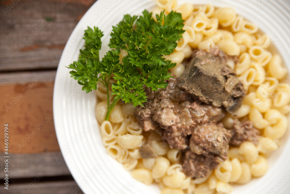 Delicious pasta with stewed chicken liver and parsley Delicious pasta with stewed chicken liver and parsley