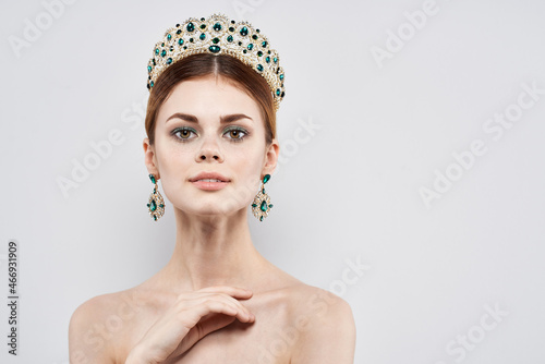 Princess naked shoulders jewelry cosmetics attractive look light background