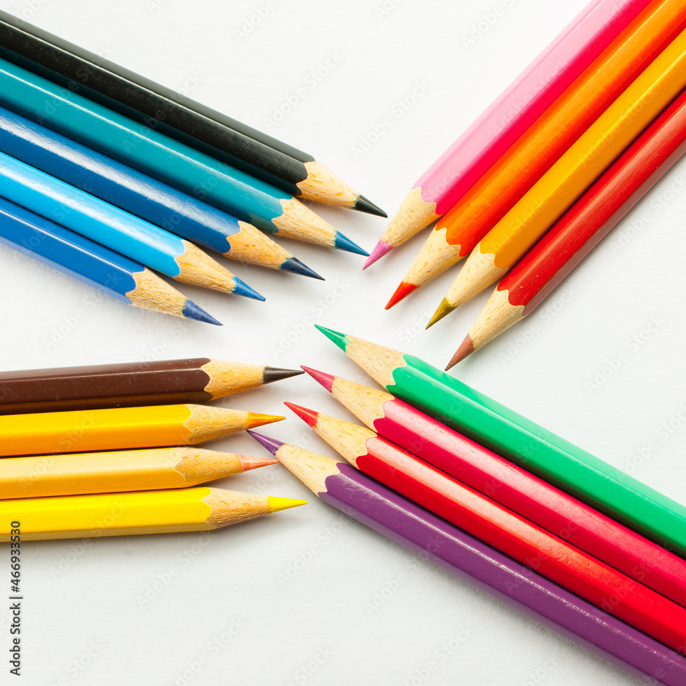 Pencils group . brightly colored pencils placed creatively on a white background.concept art design copy space school and office. Pencils group . brightly colored pencils placed creatively on a white background.concept art design copy space school and office.