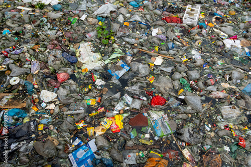 The mouth of the canal is blocked by piles of plastic waste and food waste dumped in the city of Jatrabari, Dhaka.