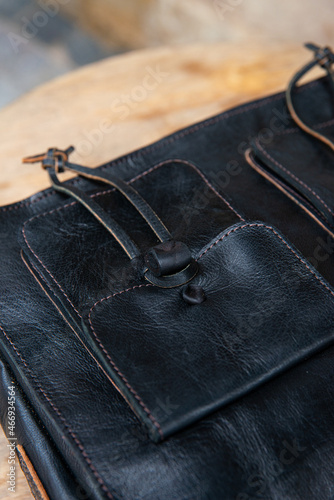 close-up photo of black leather bag corporate.