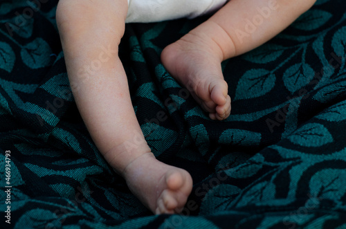 closeup newborn baby feet on blanket