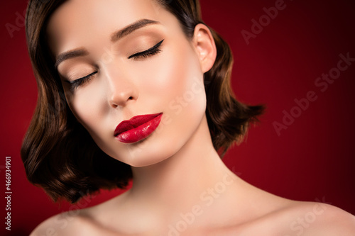 Photo of tender beautiful attractive female model face vogue make up red lips isolated on gradient dark background