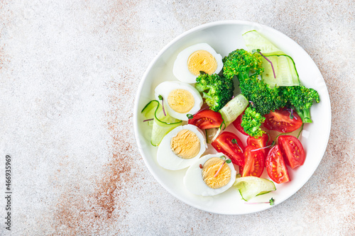 salad buddha bowl boiled egg, broccoli, tomato, cucumber, vegetables meal snack on the table copy space food background veggie vegan or vegetarian 