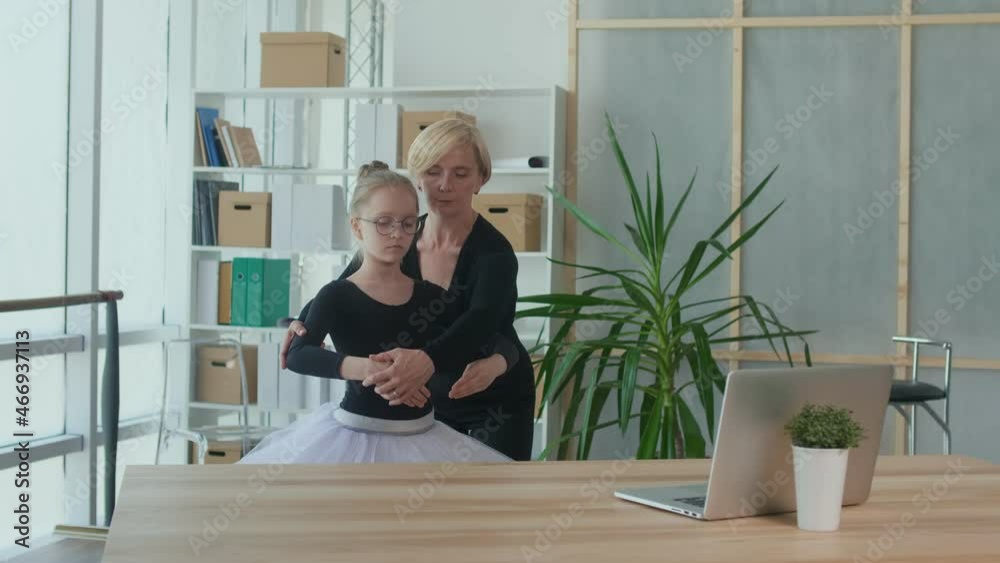 Cute Girl Ballerina, a Student Doing Ballet in Online Class With Her Trainer. Sports, Healthy Lifestyle, Childhood Dream. Online Education and Homeschooling Concept. Cute Girl Ballerina, a Student Doing Ballet in Online Class With Her Trainer. Sports, Healthy Lifestyle, Childhood Dream. Online Education and Homeschooling Concept.