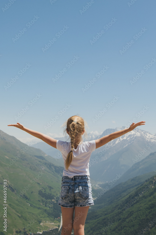 Happy preteen girl hiking on caucasian mountains in summer. Happy preteen girl hiking on caucasian mountains in summer.