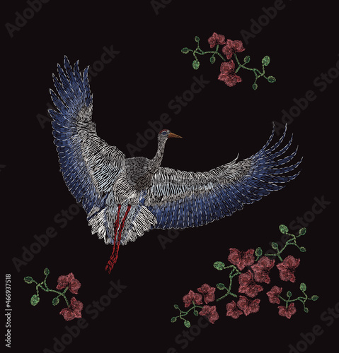 Satin stitch embroidery design with Asian crane and orchids. Folk line flora and fauna trendy pattern. Ethnic fashion decor on black background. Colorful vector illustration.