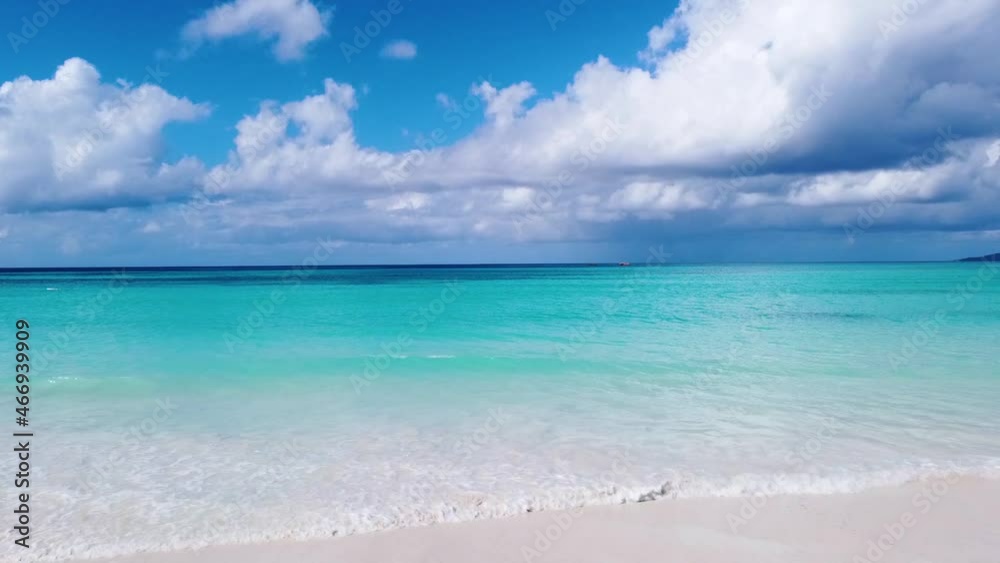 Tranquil aerial view of a tropical beach in the Seychelles. Ocean waves on the shore Tranquil aerial view of a tropical beach in the Seychelles. Ocean waves on the shore