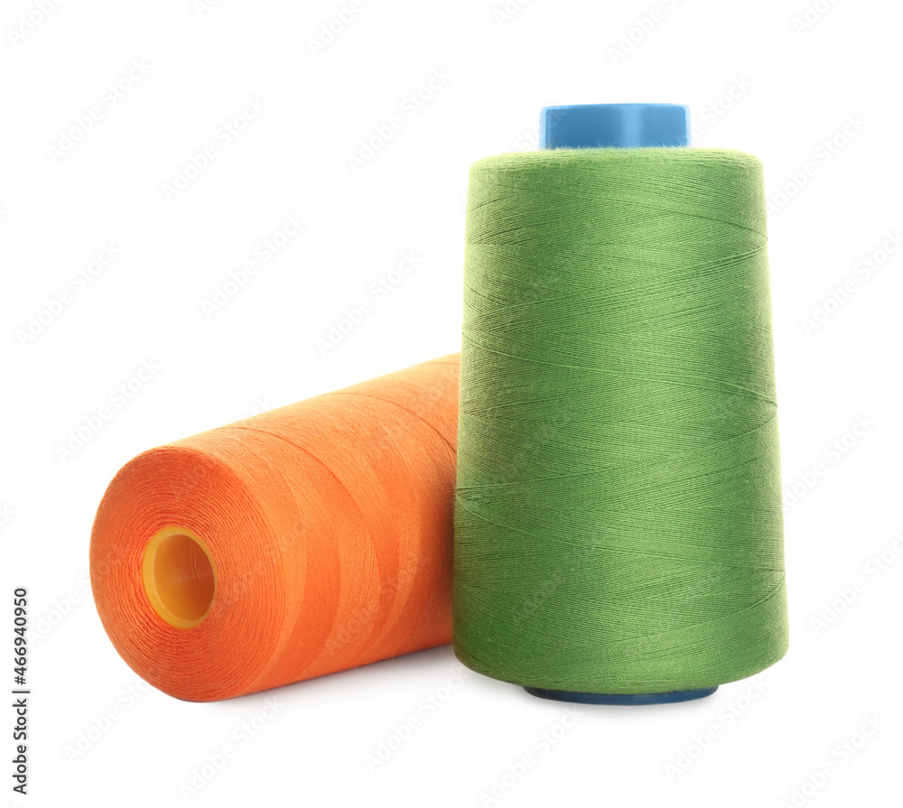 Different colorful sewing threads on white background Different colorful sewing threads on white background