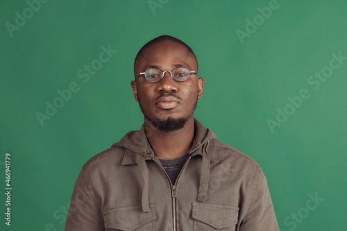 Young man's portrait isolated on studio background with copyspace for ad. Flyer