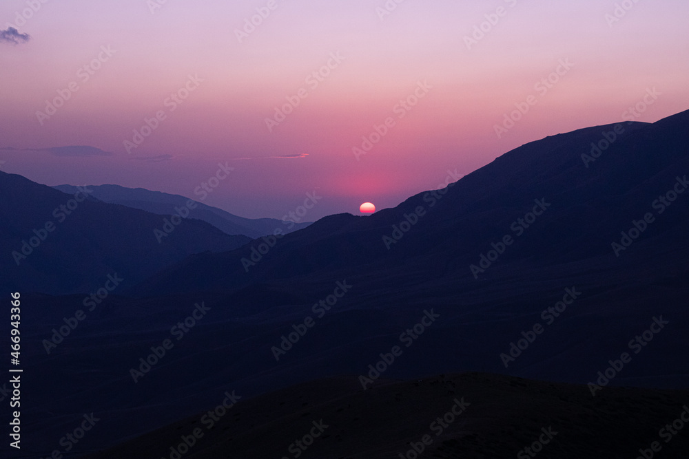Beautiful sunset on the background of mountains Beautiful sunset on the background of mountains