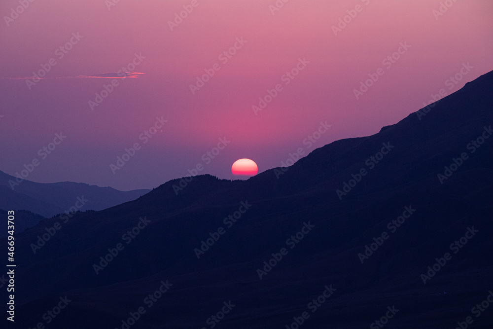 Beautiful sunset on the background of mountains Beautiful sunset on the background of mountains