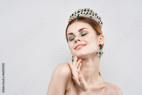 beautiful woman luxury naked shoulders cosmetics fashion light background