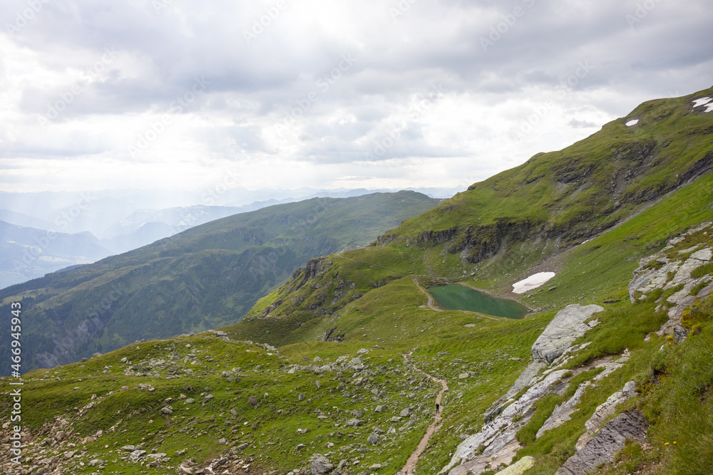 Amazing hiking day in one of the most beautiful area in Switzerland called Pizol in the canton of Saint Gallen. What a wonderful landscape in Switzerland at a sunny day. Beautiful alpine lake.