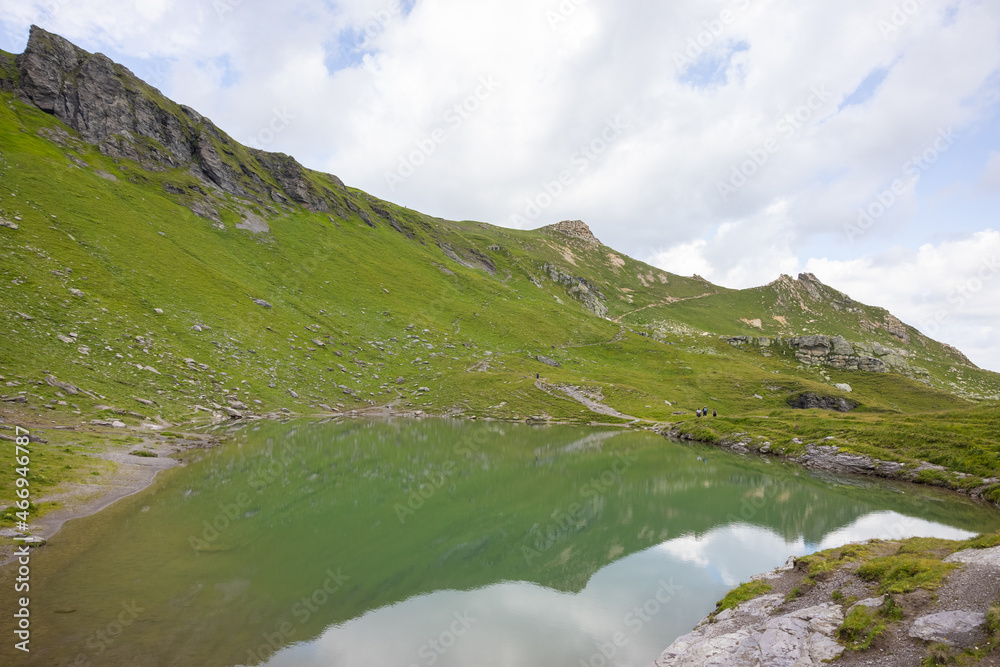 Amazing hiking day in one of the most beautiful area in Switzerland called Pizol in the canton of Saint Gallen. What a wonderful landscape in Switzerland at a sunny day. Beautiful alpine lake.