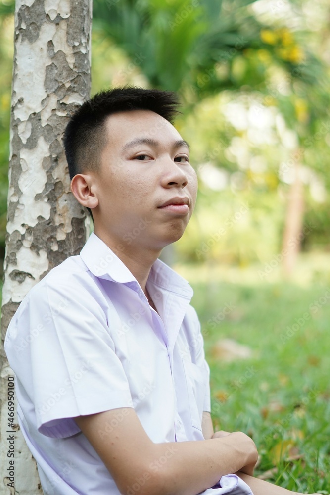 close up cute man in nature garden close up cute man in nature garden