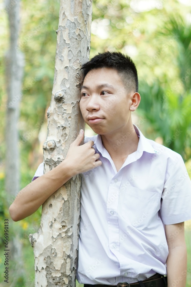 close up cute man in nature garden close up cute man in nature garden