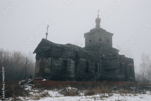 Old abandoned wooden ruined Russian church of Athanasius the Great in Lower Babino, Kursk region photo