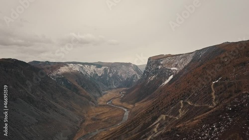 Katu Yaryk mountain pass in the valley of the Chulyshman River, Altai, Siberia, Russia. A huge stone gorge, a canyon, a mountain winding river, a dangerous serpentine highway. Freedom, loneliness