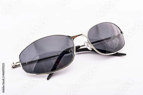 Gray sunglasses with a golden rim