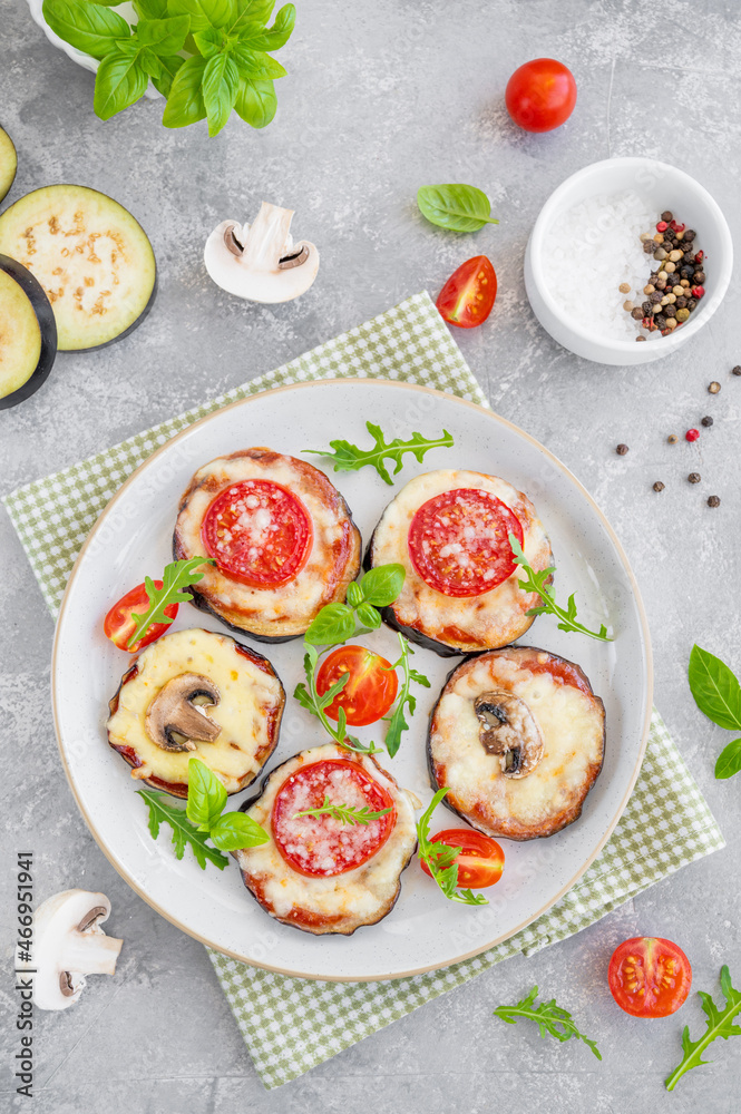 Eggplant pizza with tomatoes sauce, mozzarella, mushrooms and fresh basil. Vegetarian dish. Selective focus Eggplant pizza with tomatoes sauce, mozzarella, mushrooms and fresh basil. Vegetarian dish. Selective focus