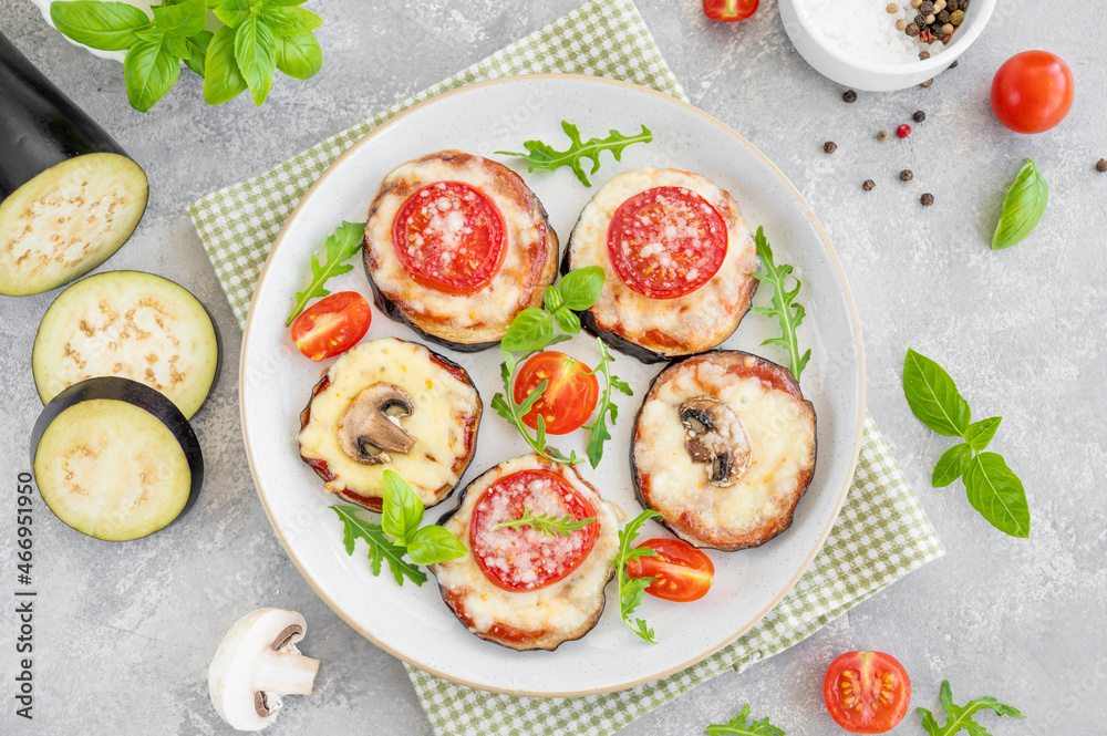 Eggplant pizza with tomatoes sauce, mozzarella, mushrooms and fresh basil. Vegetarian dish. Selective focus Eggplant pizza with tomatoes sauce, mozzarella, mushrooms and fresh basil. Vegetarian dish. Selective focus