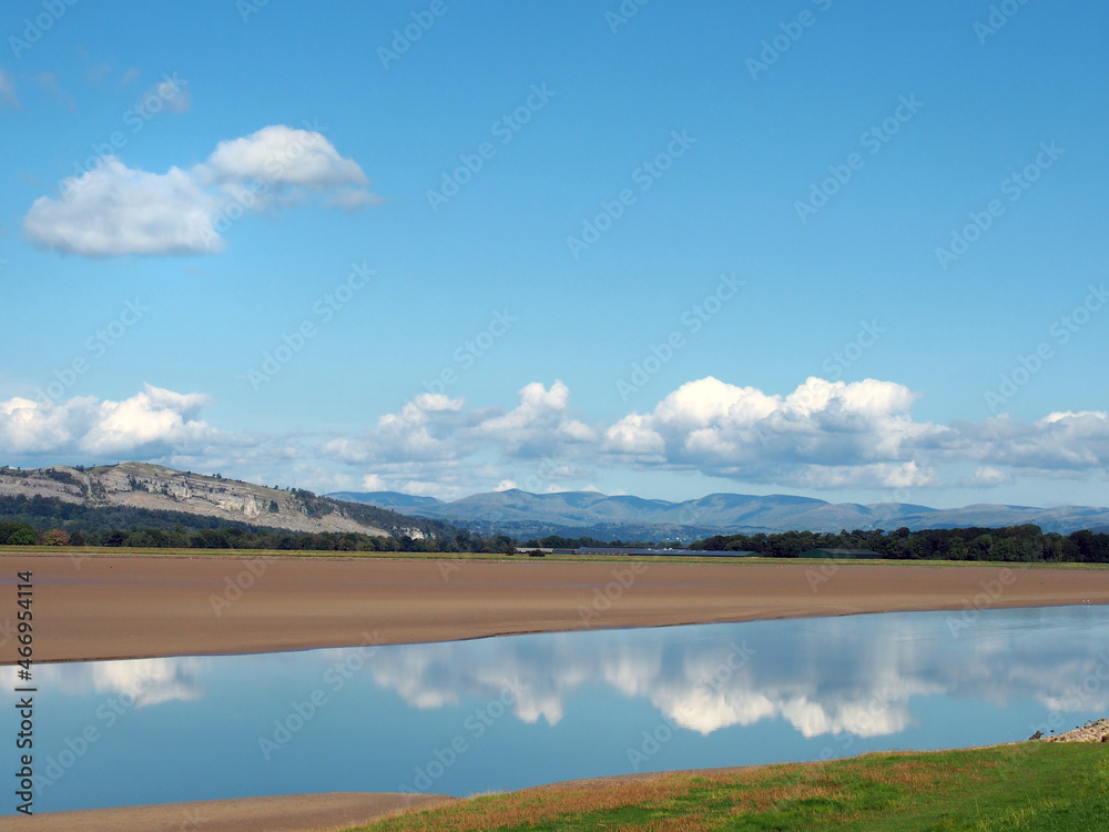 view of the river kent near arnside and sandside in cumbria with surrounding lakeland hills