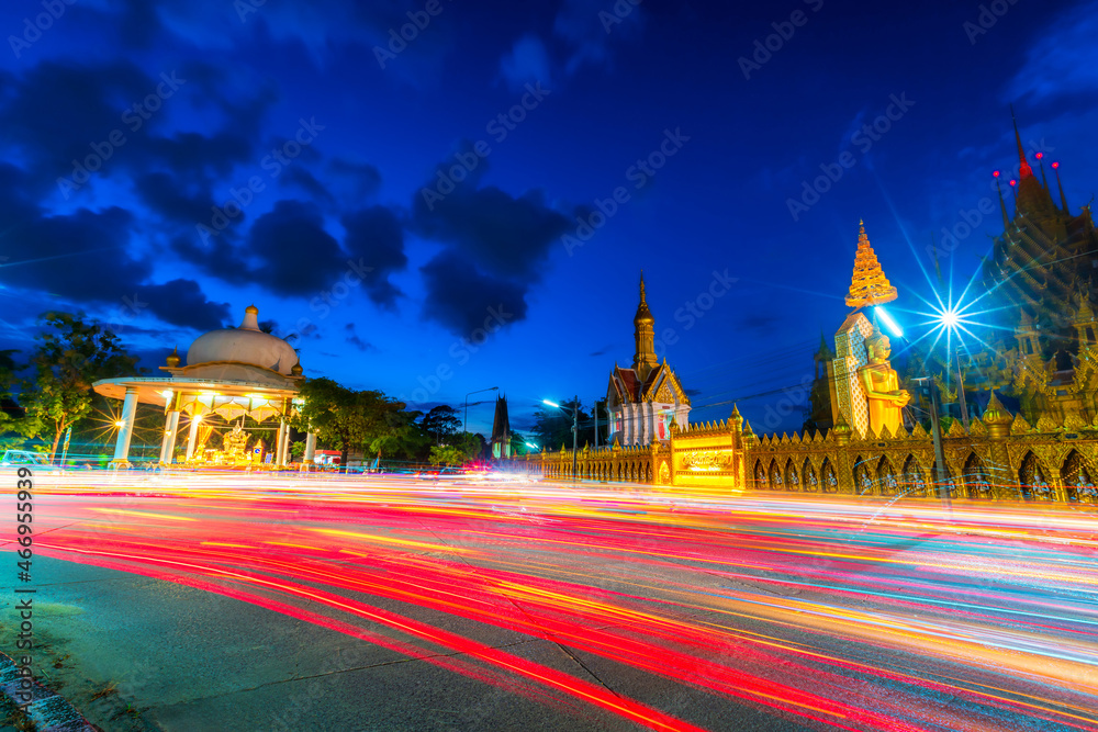 The color beautiful of Night traffic lights on the Road in Temple (Thai reads as :Wat Chan West) is a Buddhist temple It is a major tourist Public places attraction Phitsanulok,Thailand.