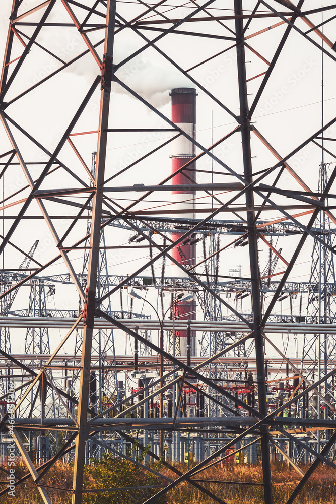 Power plant with smoking chimney, color toning applied.